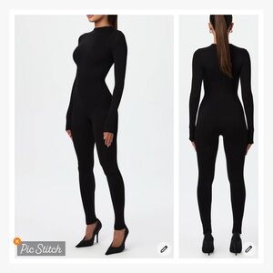 Signature jumpsuit is designed to sculpt with gentle compression & back zipper